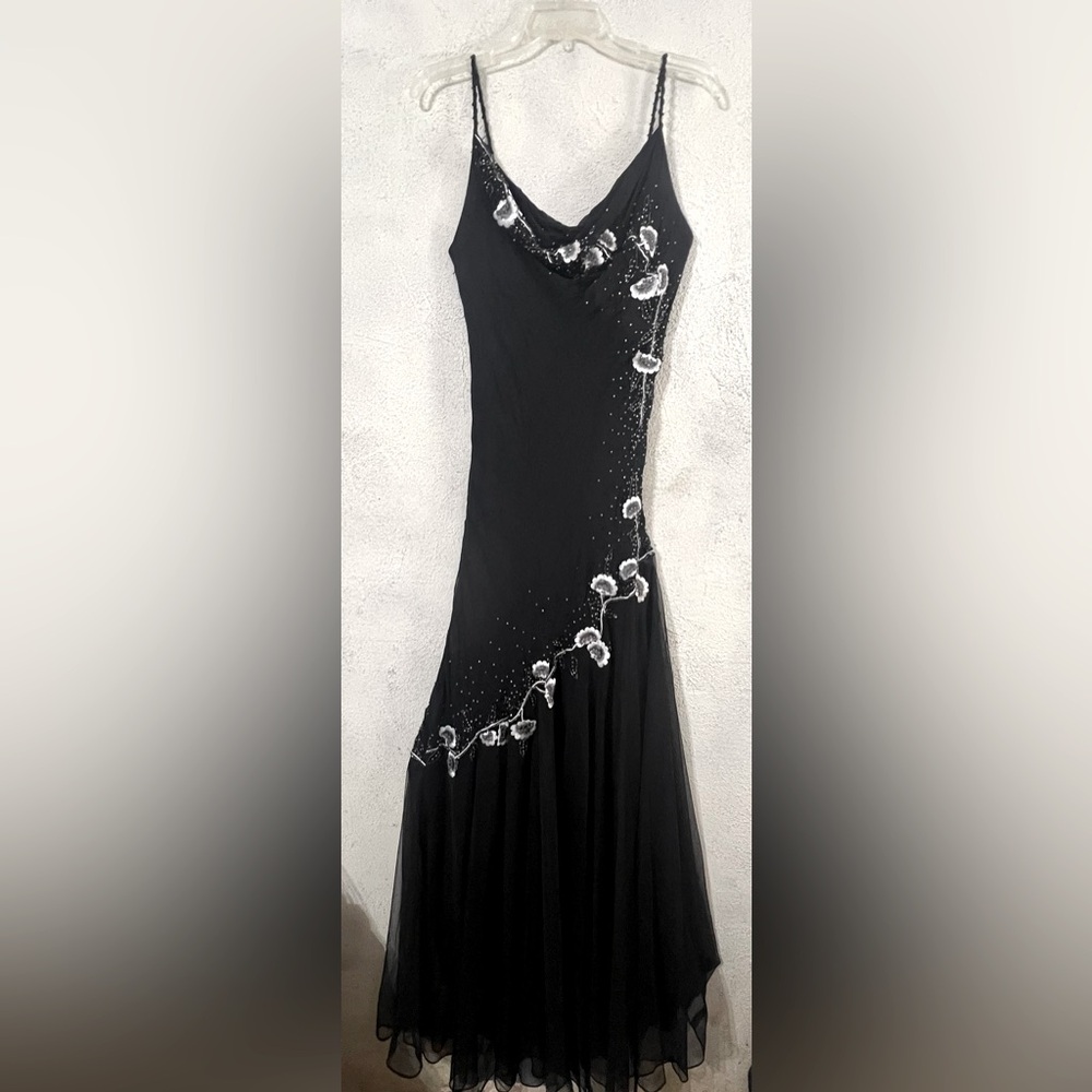 Xscape by Joanna Chen
 Beautiful black gown with mesh and beaded details size 6